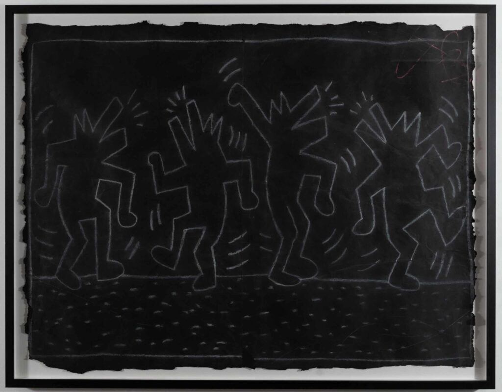 weiß auf schwarz "Subway Drawing" von Keith Haring in der 25 Ausstellung im MUCA München erleben